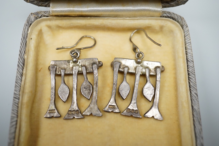 Michael Allen Bolton, a silver cross pendant and a pair of earrings, comprising: a cross pendant of textured design, length 5.1cm, British hallmarks for silver, sponsor's mark MAB, date letter for 1977, on a silver chain
